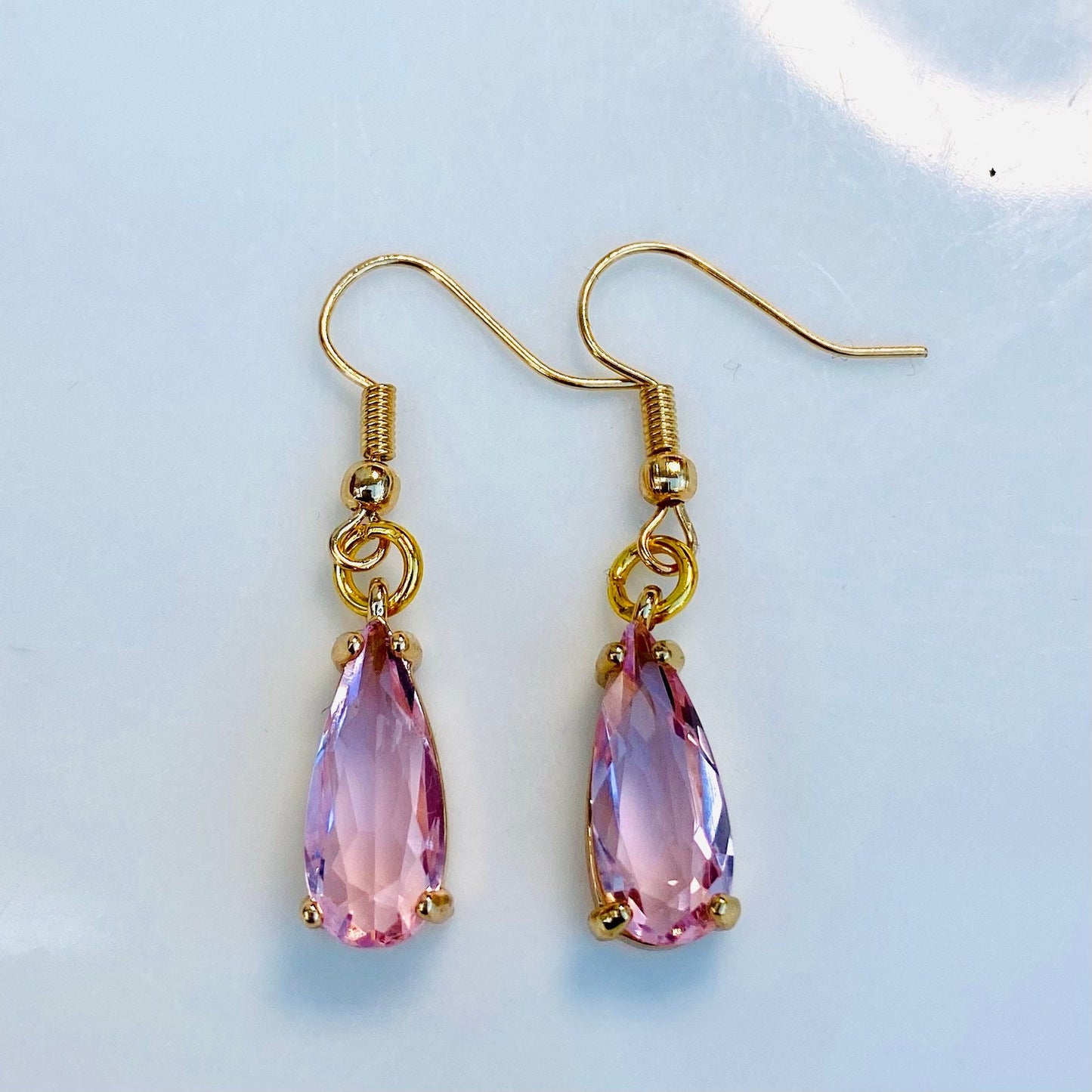handmade clear pink gemstone in claw setting gold birthstone earrings dangle