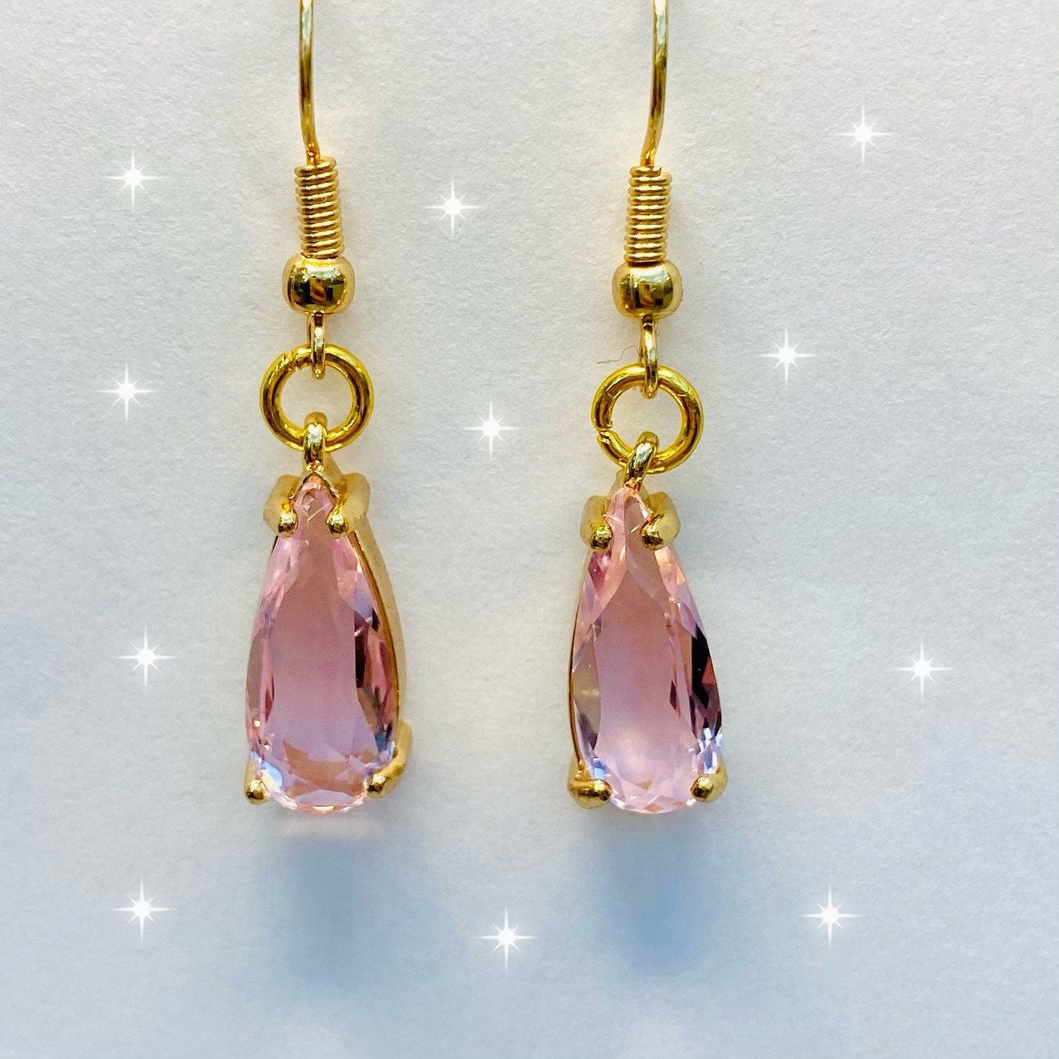 handmade clear pink gemstone in claw setting gold earrings dangle