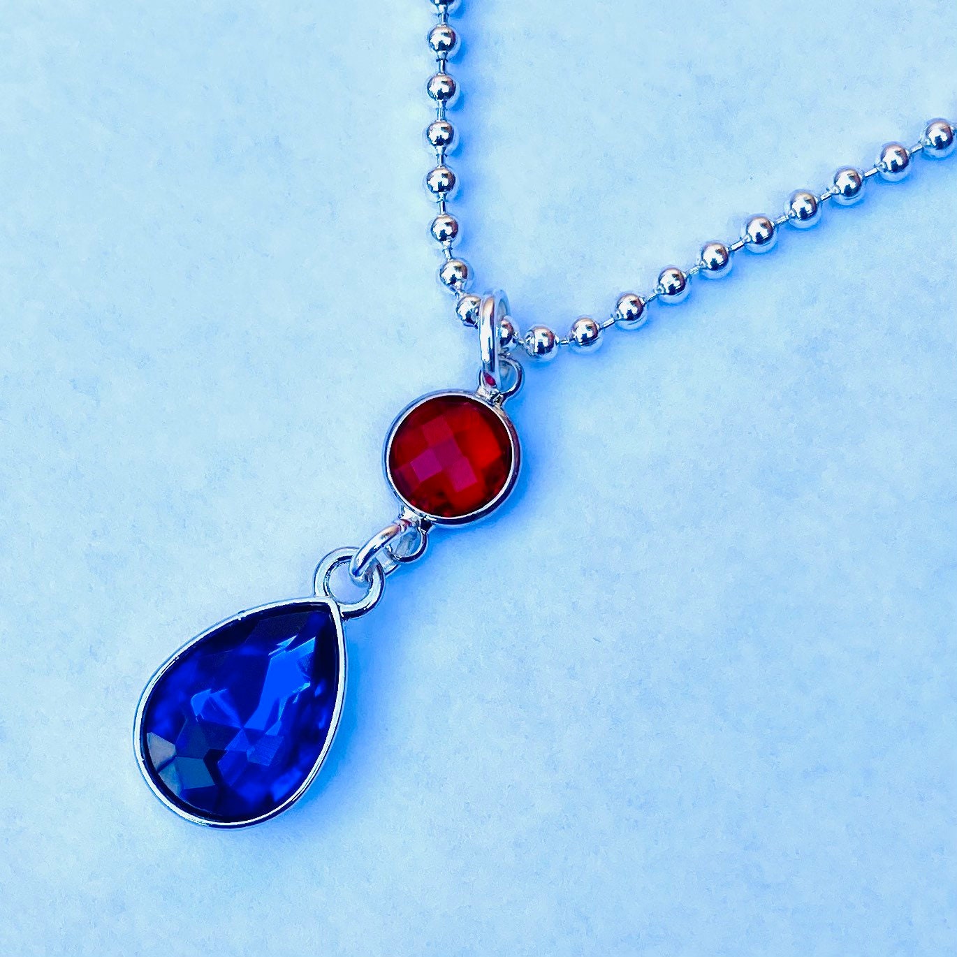 Two gem howls red blue crystal gem pendant silver ball bead necklace.  